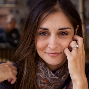 A closeup of Emmy-nominated journalist Erin D. Cauchi.