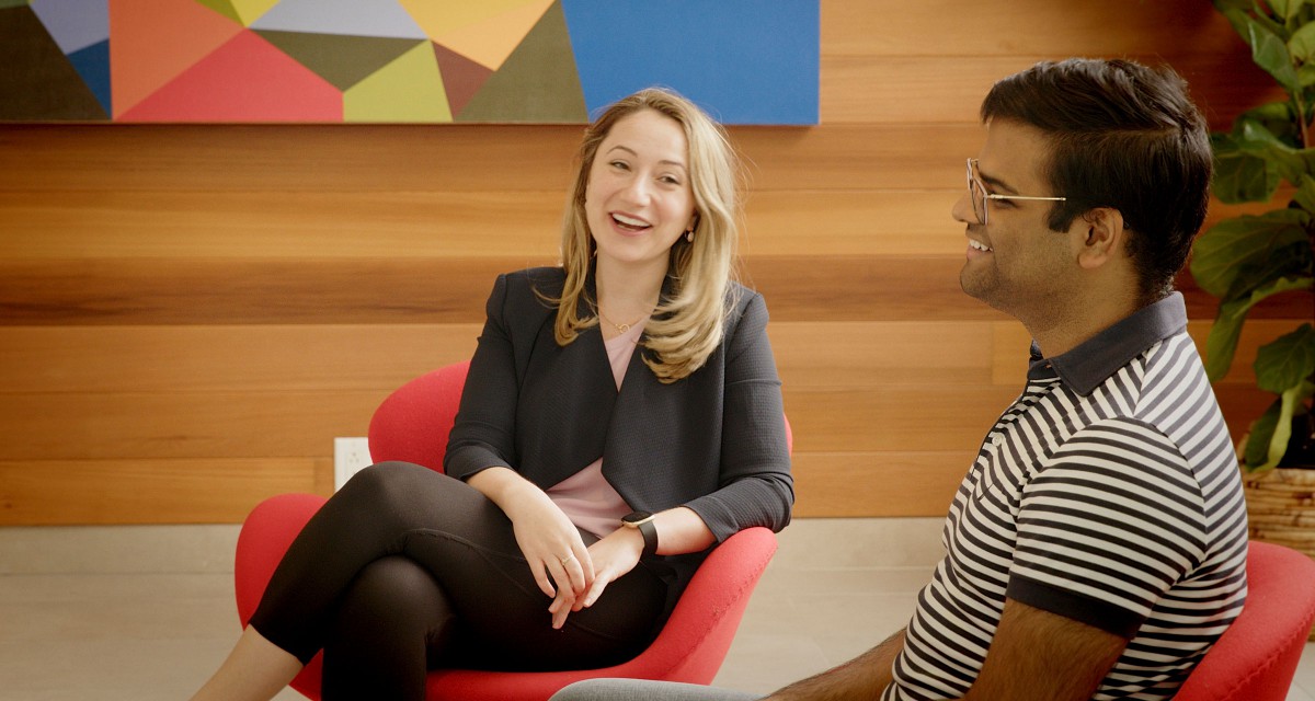 A mentor and student chat in the Goldring Student Centre.