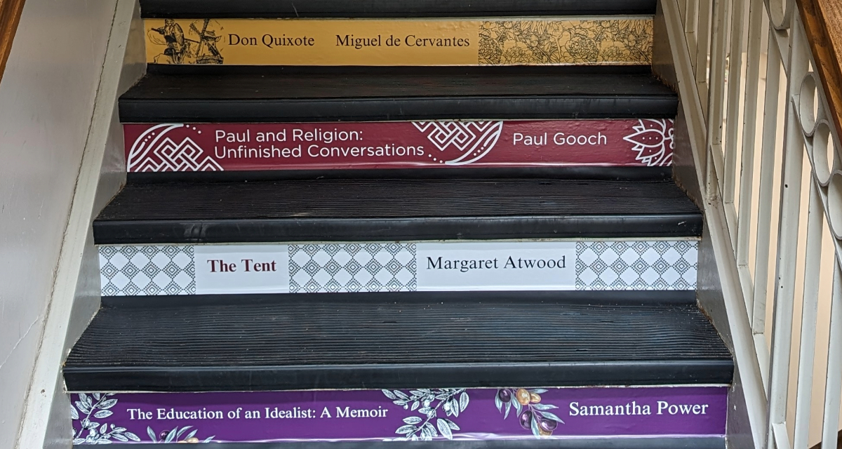 Stairs in Old Vic building with book spine decals.