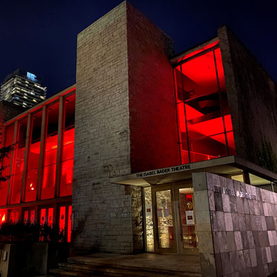 Isabel Bader Theatre lit in red to support Light Up Live